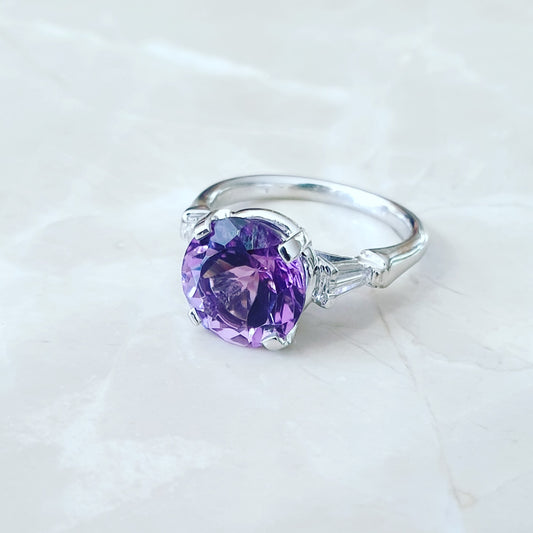 Amethyst solitaire with baguette cut diamonds on the sides